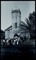 Father Philip Blom, SS.CC., and boys in front of Saint Philomena Church, Kalawao, Molokai, 1914.